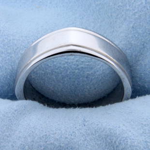 Unique 7mm Men's Band Ring With Small Peaks in 14K: In 14K White Gold. 7mm wide, size 10. Band is not perfectly round on outside, comes to a small peak on each "corner" of ring. 10.1g.