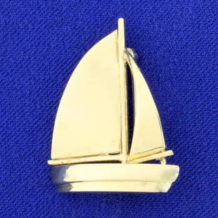 Sailboat Pin In 14K Yellow Gold: In 14K Yellow Gold. 1 1/8 inches long, 7/8 inch wide. 7.8g.