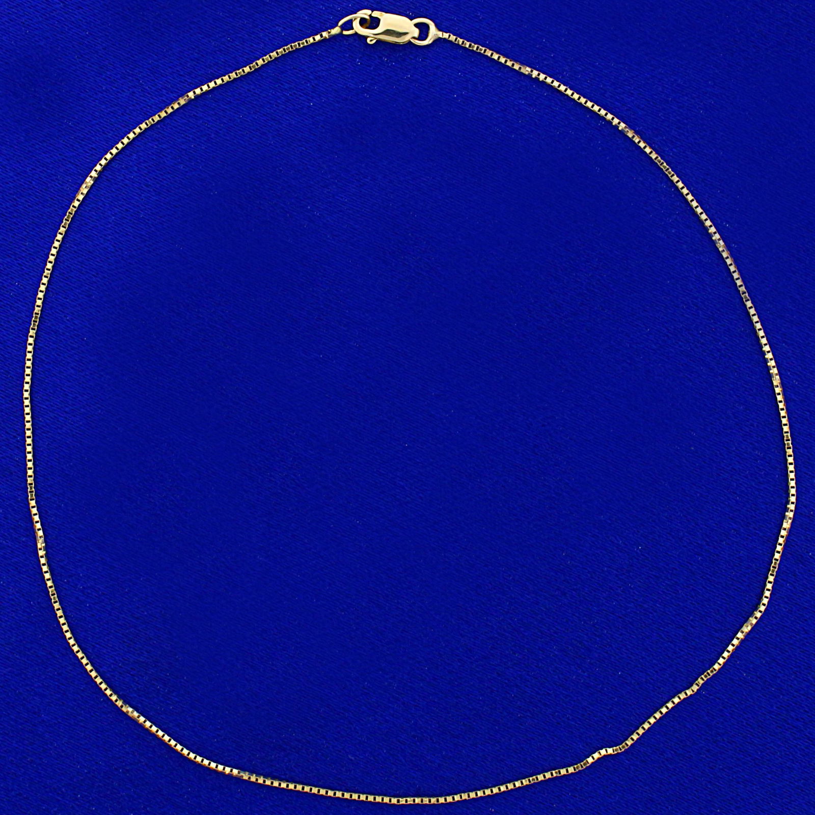 Box Link Anklet in 14K Yellow Gold: In 14K Yellow Gold. 10 inches long, .7mm wide. Lobster clasp. 0.8g.