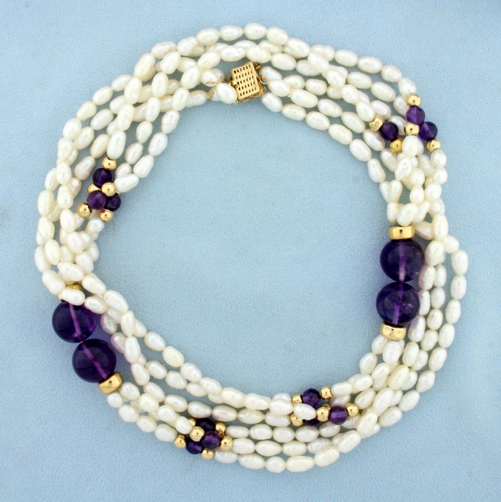 Amethyst, Gold Bead, and Pearl Necklace in 14K Yellow: In 14K Yellow Gold. Contains 243 high quality natural Baroque Pearls, ranging from 4.5-5mm each with mirror like luster. Also contains four 14mm and 12 6mm high quality Amethyst gemstone beads with vi