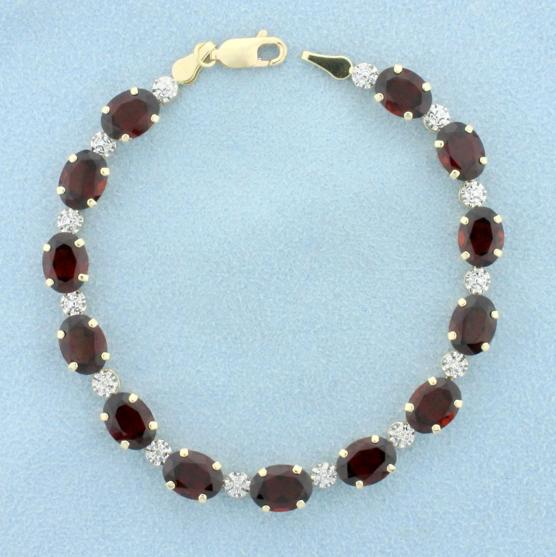 Garnet and Diamond Line Bracelet in 10K Yellow Gold: In 10K Yellow Gold. Contains thirteen high quality natural 8 x 6mm oval Garnet gemstones with vibrant red color and excellent clarity. Also contains six high quality 1/2pt Diamonds. 7 inches long, 6mm