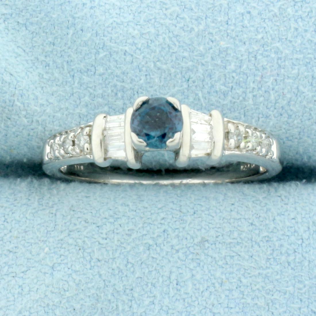 Natural Alexandrite and Diamond Ring in 14K White Gold: In 14K White Gold. Contains one high quality natural 4mm round Alexandrite gemstone, 1/4ct, that changes color from green to purple depending on light source. Also contains six high quality 2 x 1mm ba