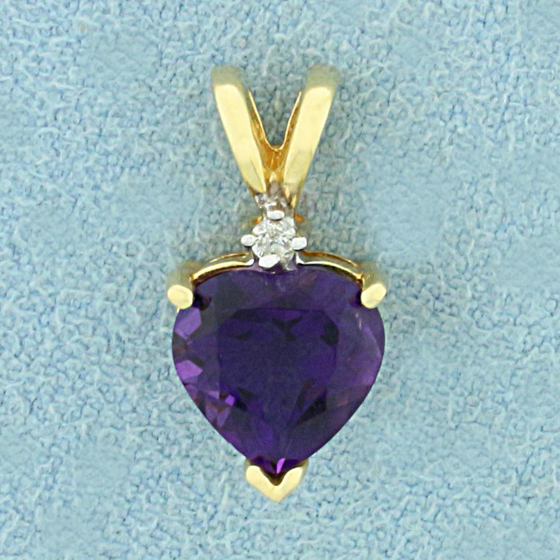 Amethyst and Diamond Heart Pendant in 10K Yellow Gold: In 10K Yellow Gold. Contains one high quality natural 8mm heart cut Amethyst gemstone with intense purple color and excellent clarity. Also contains one high quality .01ct round cut Diamond. 1/2 inch 