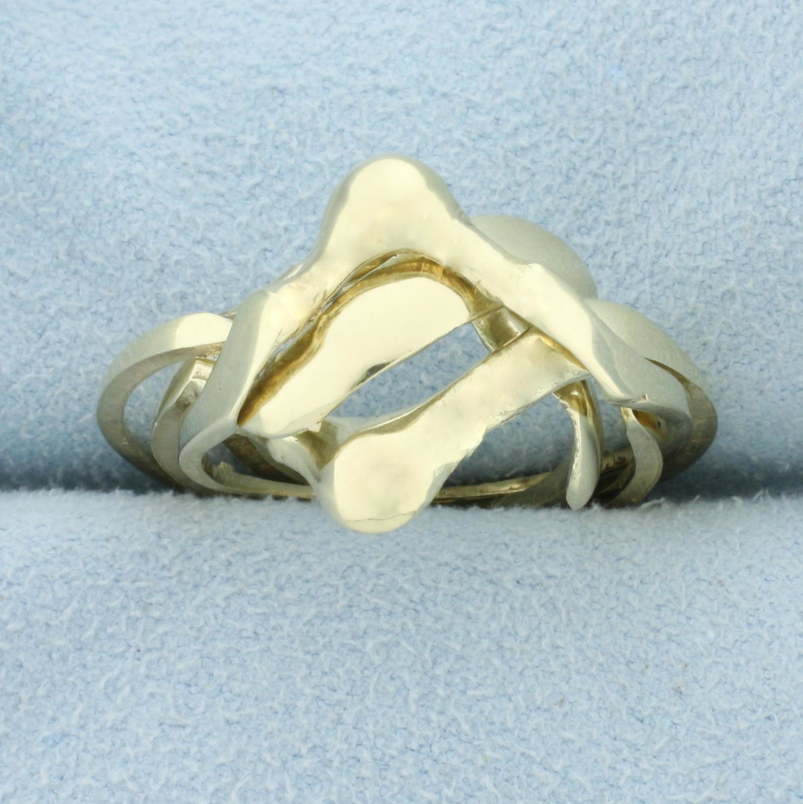 Unique Puzzle Ring In 14K Yellow Gold: In 14K Yellow Gold. Four rings can be stacked together in many different orders to produce new looks. Size 10. 4.6g.