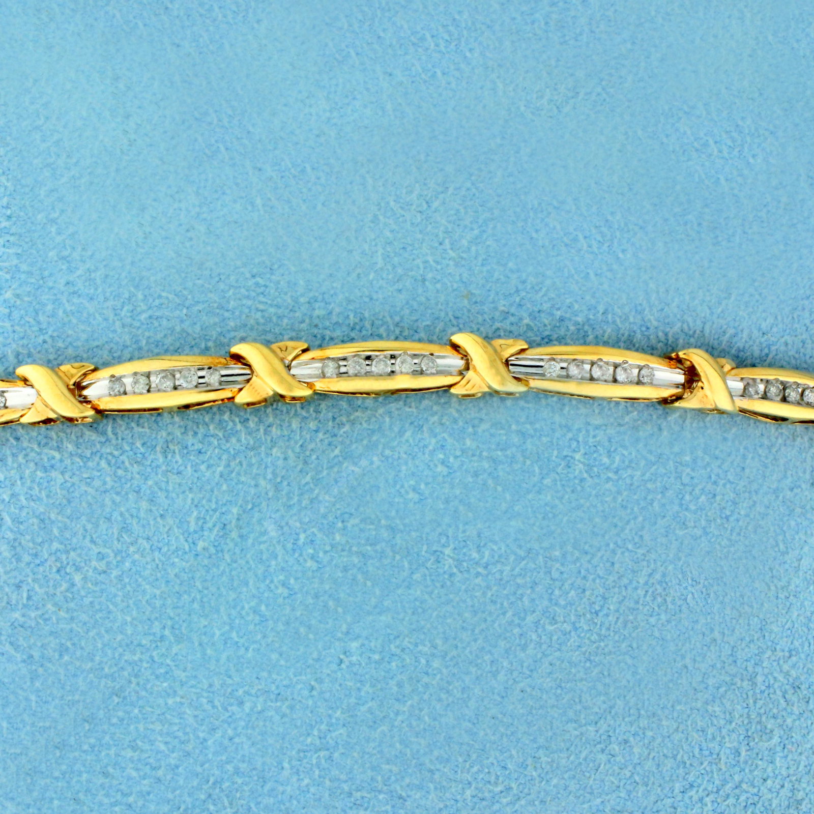 1/2ct TW Diamond Tennis Bracelet in 10K Yellow Gold: In 10K Yellow Gold. Contains sixty high quality Diamonds, 1/2ct TW, I color/I clarity. 7 inches long, 4.2mm wide. Safety clasp. 6.9g.