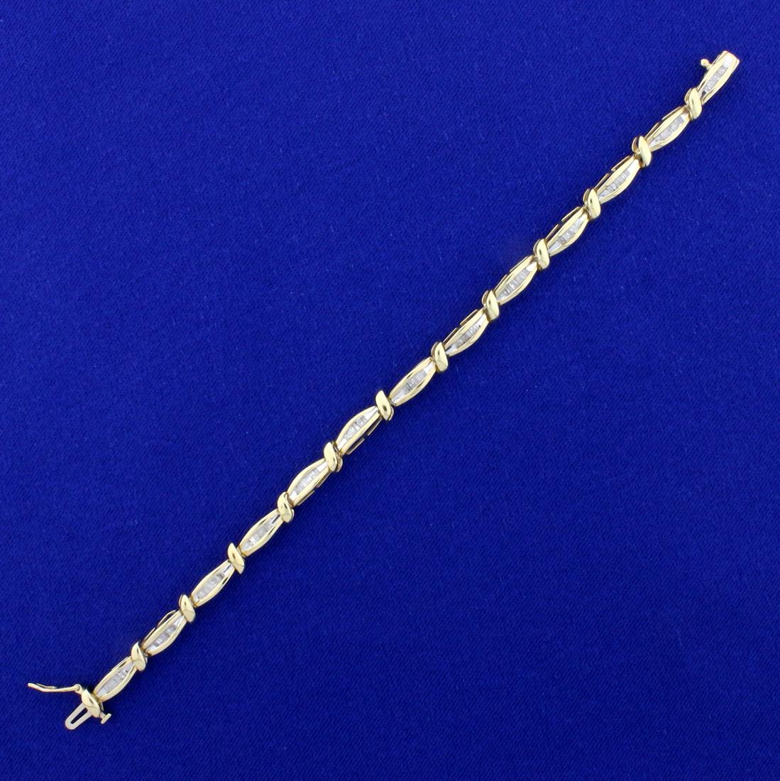 3/4ct TW Baguette Diamond Tennis Bracelet in 10K Yellow: In 10K Yellow Gold. Contains seventy-eight high quality .01ct baguette shaped Diamonds. 6 1/2 inches long and 3.9mm wide. 7.7g