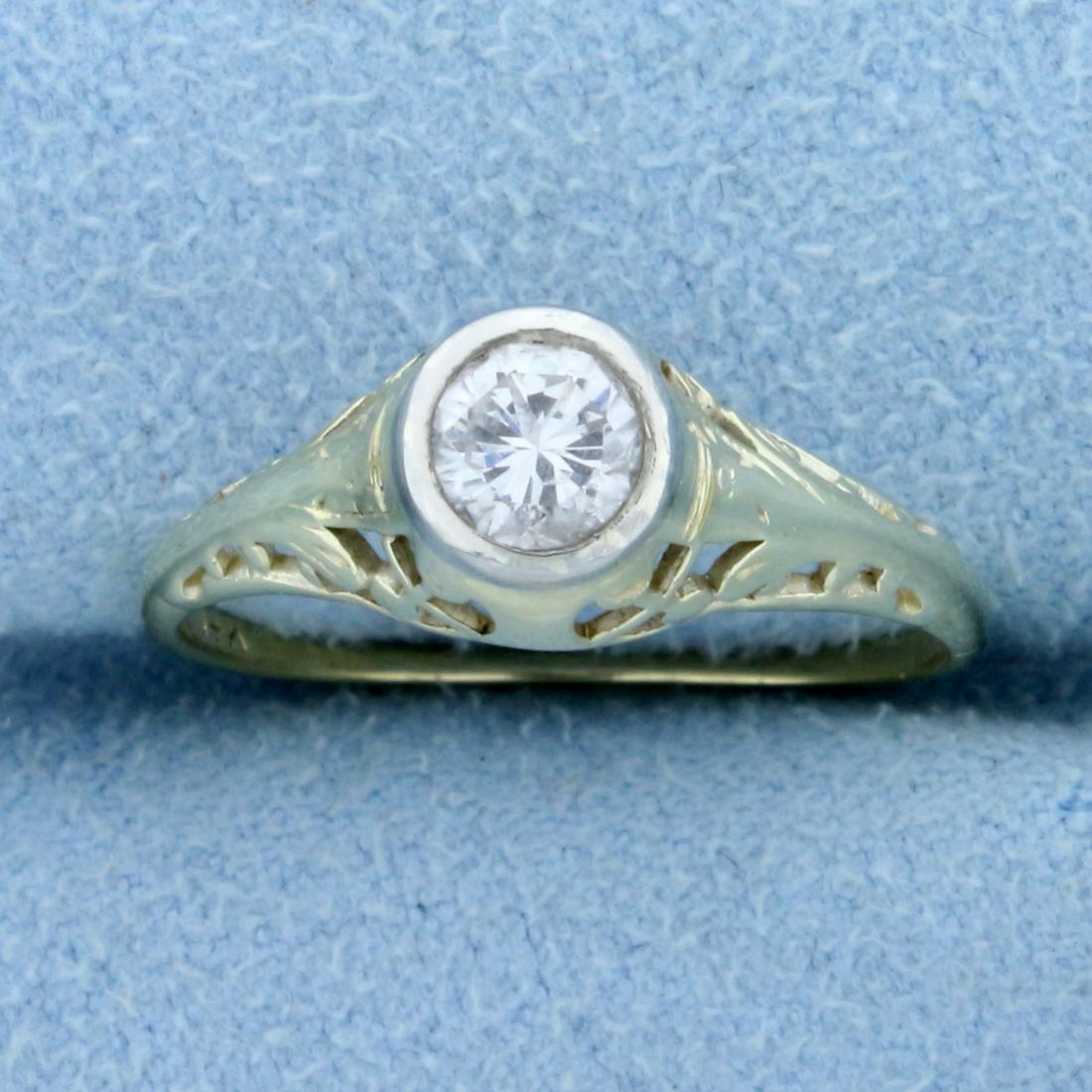 Filigree Edwardian Solitaire .4ct Diamond Ring in 14K: In 14K Yellow Gold. Contains one high quality .4ct round cut Diamond I color/SI clarity, great cut for lots of sparkle. Set in detailed filigree mounting. Size 6 1/4.