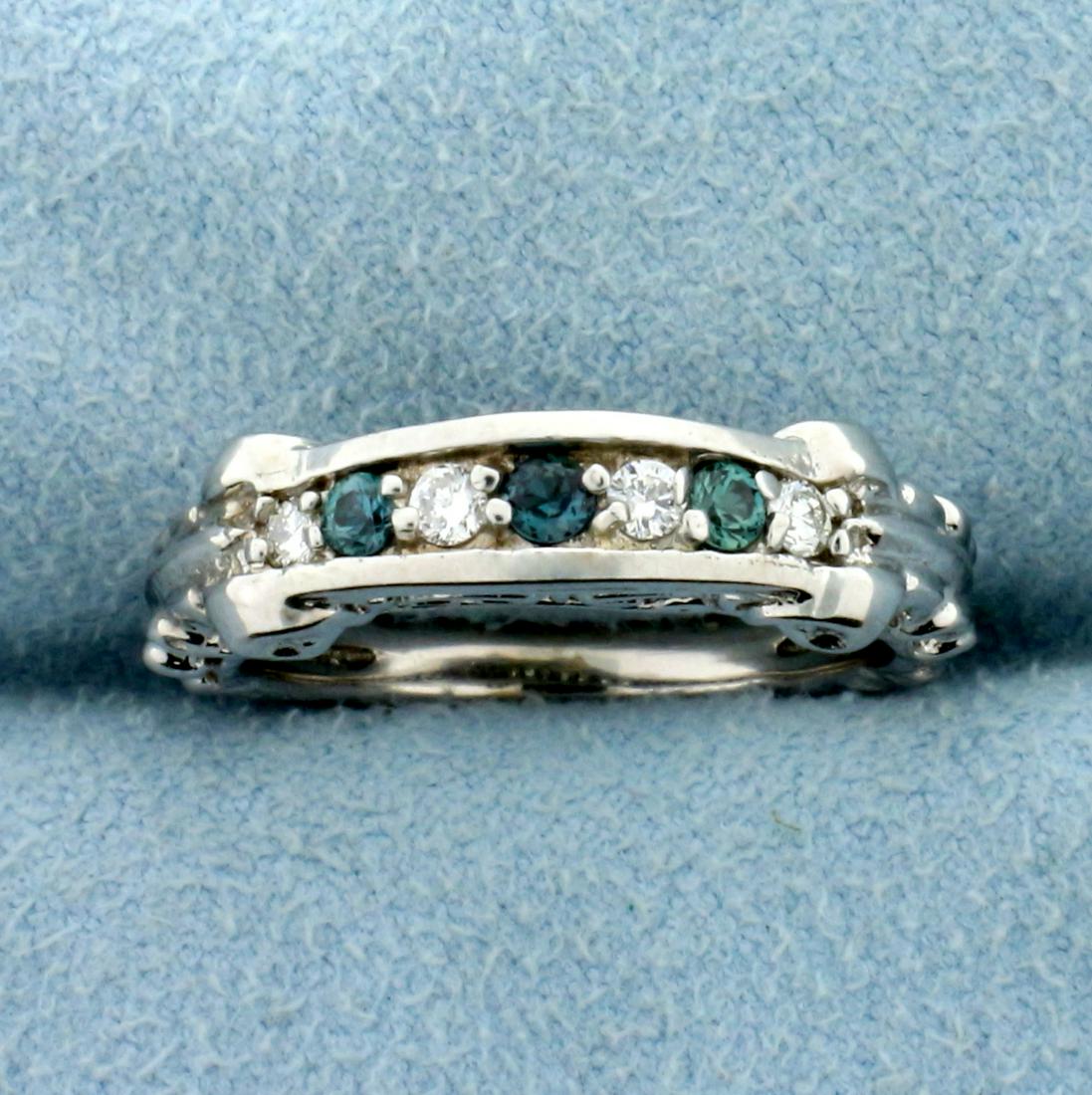 Unique Hand Designed Alexandrite and Diamond Ring in: In 14K White Gold. Contains three high quality natural 2.5mm Alexandrite gemstones that change color from deep green to light purple color depending on light source with excellent clarity. Also contai