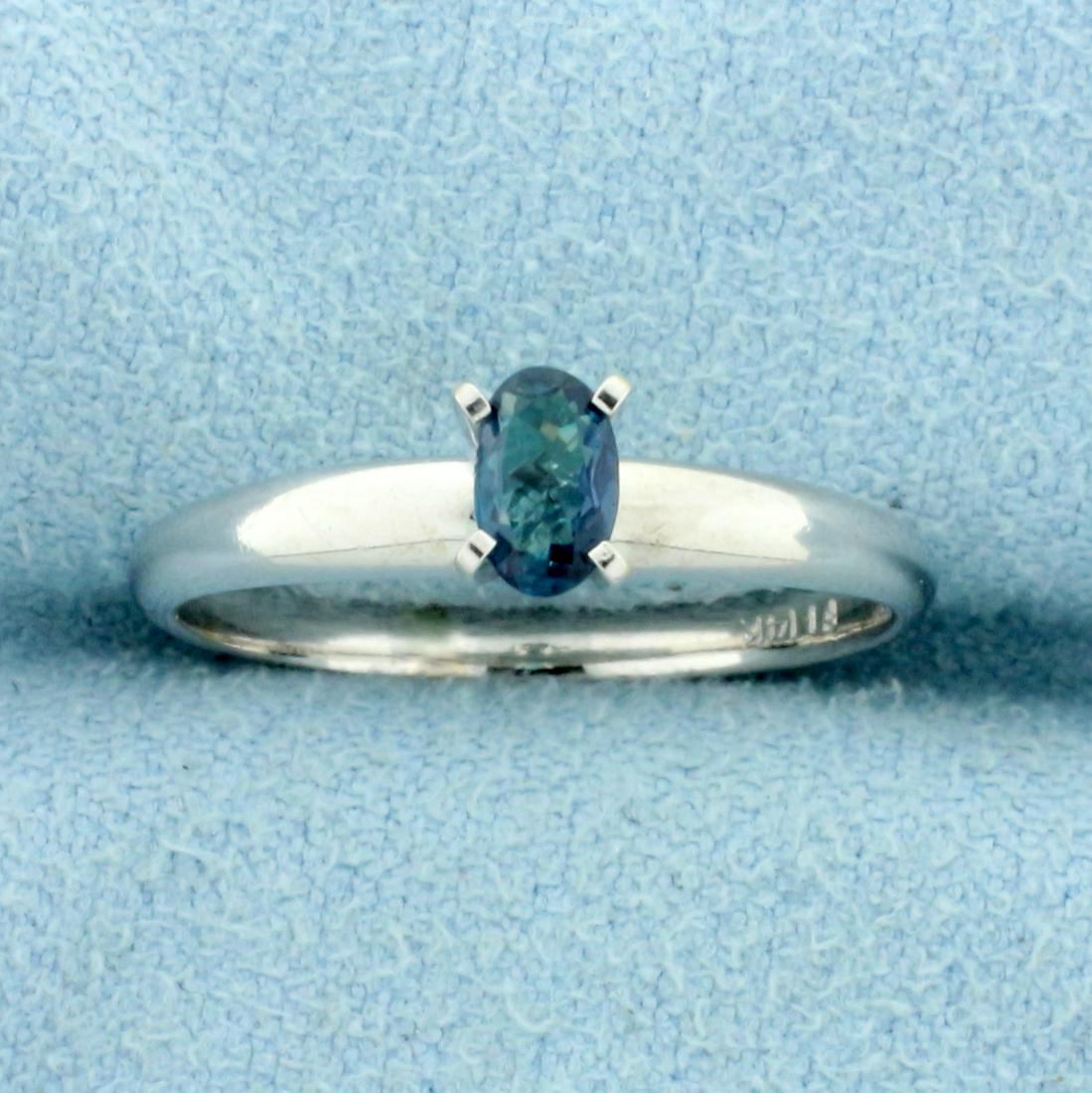 Natural Alexandrite Solitaire Ring in 14K White Gold: In 14K White Gold. Contains one high quality natural 5 x 3mm oval cut Alexandrite gemstone with intense color change from green to purple depending on light source. Size 6 1/2. 1.9g.
