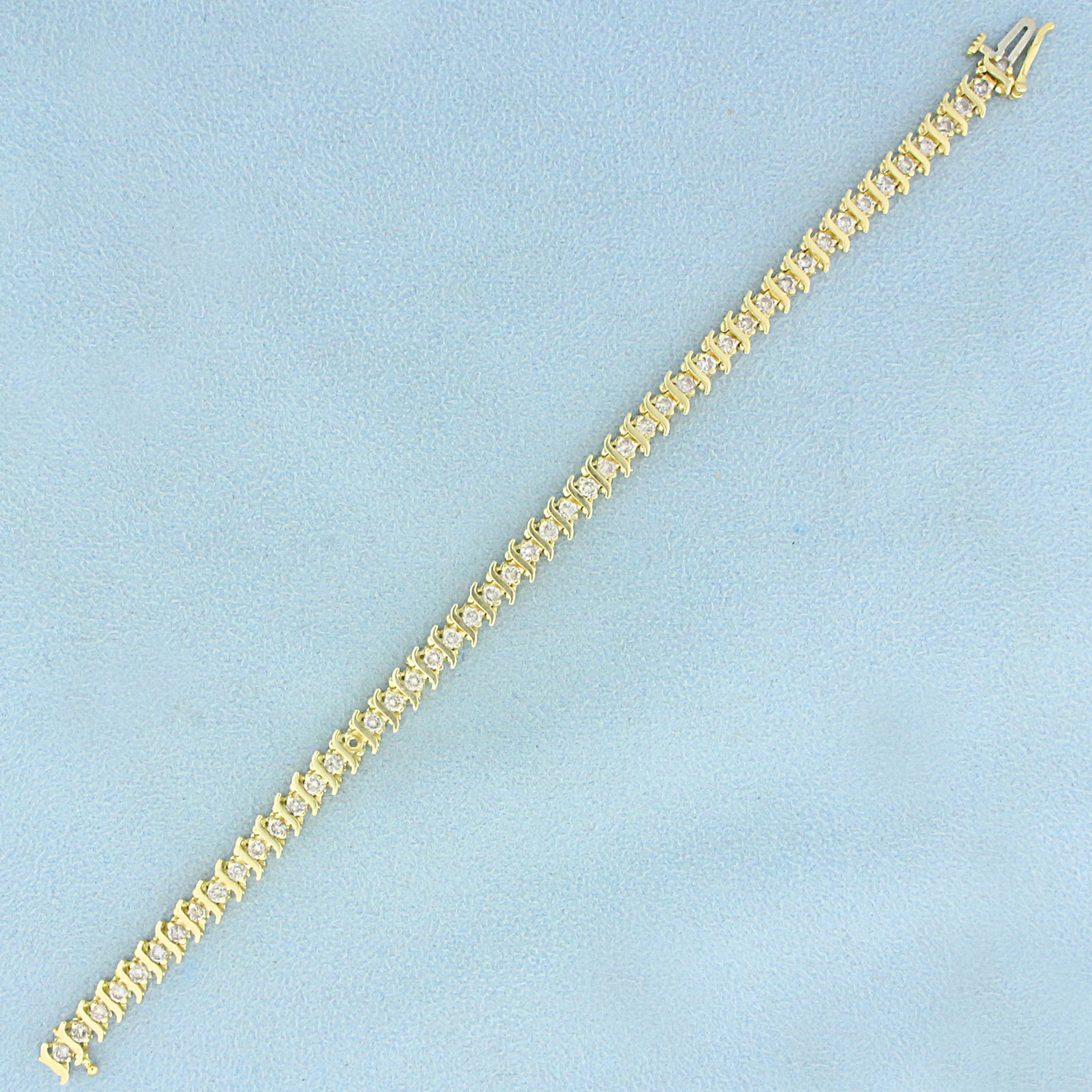 2ct TW Diamond Tennis Bracelet in 14K Yellow Gold: In 14K Yellow Gold. Contains forty- eight high quality Diamonds, J color/I clarity. 7 inches long. 5.3mm wide. Safety clasp. 11.3g