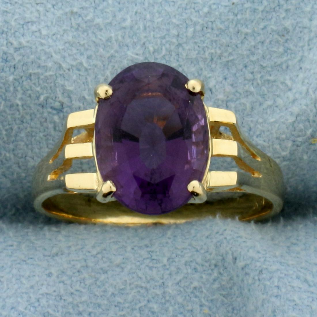 3ct Amethyst Solitaire Ring in 14K Yellow Gold: In 14k Yellow Gold. Contains one high quality natural 11x 7.9mm oval Amethyst gemstone with intense purple color and excellent clarity. Size 7. 3.2g