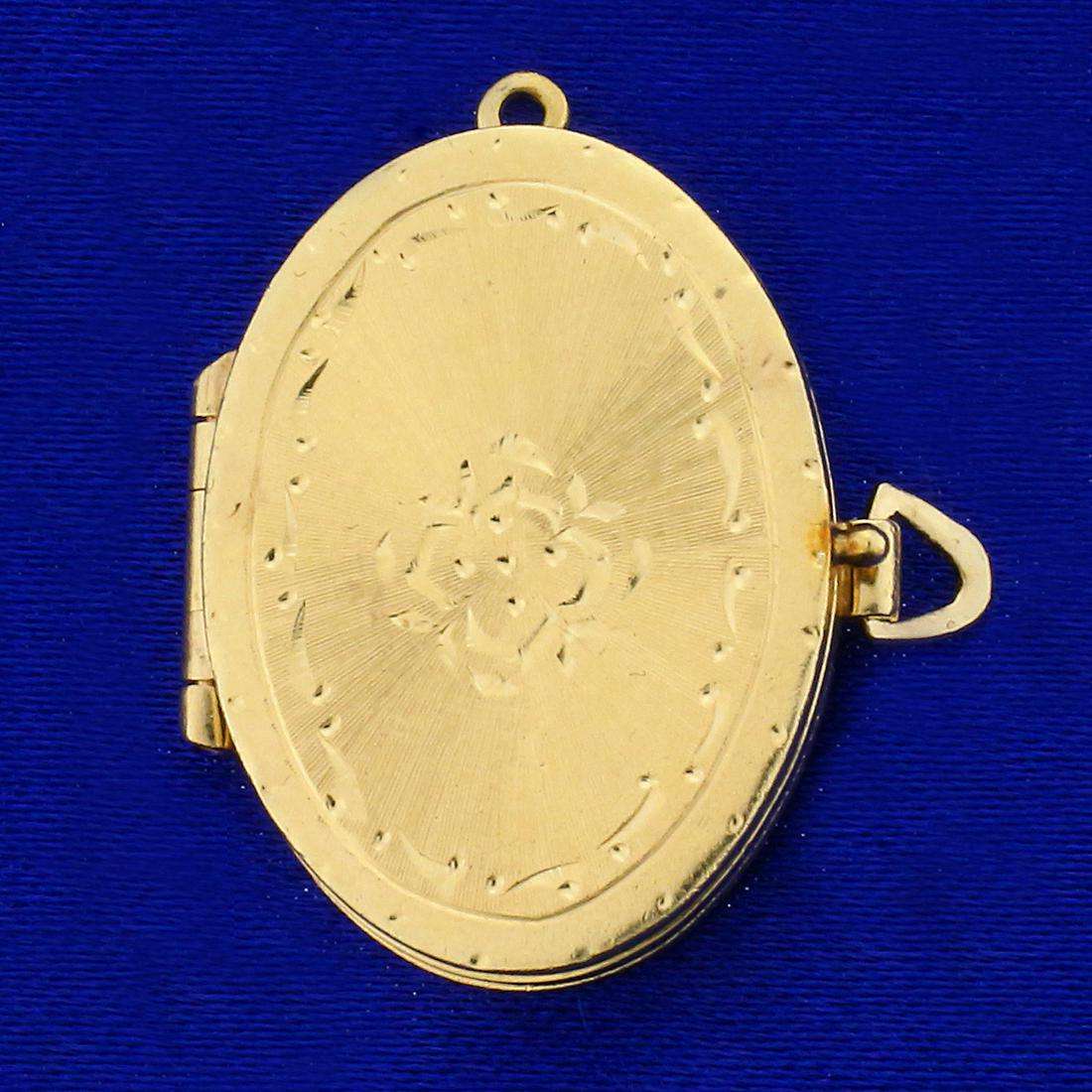 Antique Locket Pendant in 14K Yellow Gold: In 14K Yellow Gold. 1 1/8 inches long , 1 inch wide with bale. 7.5g.