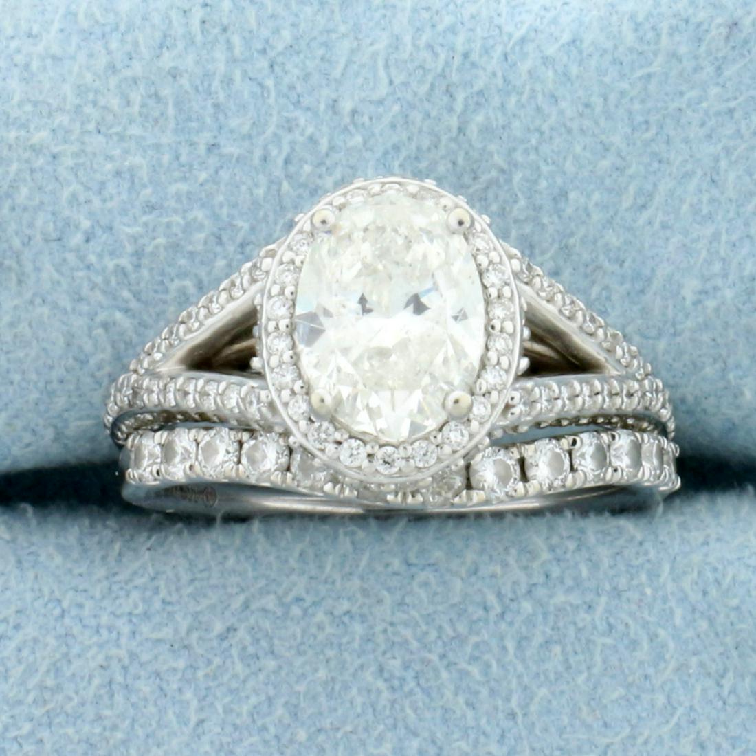 2.5ct TW Diamond Engagement Ring and Wedding Band: In 14K White Gold. Engagement ring contains a high quality 1.6ct oval Diamond, I1 clarity/J color. Diamond is eye clean (cannot see inclusions with naked eye) and great cut for lots of sparkle. Also c