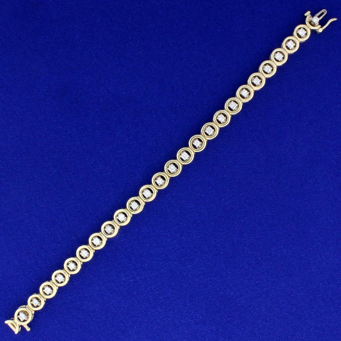 2ct TW Circle Link Tennis Line Bracelet in 14K Yellow: In 14K Yellow Gold. Contains 25 high quality round cut Diamonds, I color/ I1 clarity. 7 inches long, 7.1mm wide. Concealed clasp with safety latch. 21.6g.