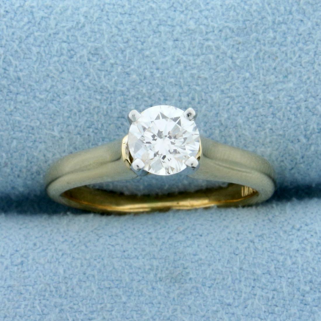 2/3ct Solitaire Diamond Engagement Ring in 18K Yellow: In 18K Yellow Gold and Platinum Head. Contains a high quality 2/3ct round brilliant diamond, VS clarity/G color. Size 5 1/2. 4.5g