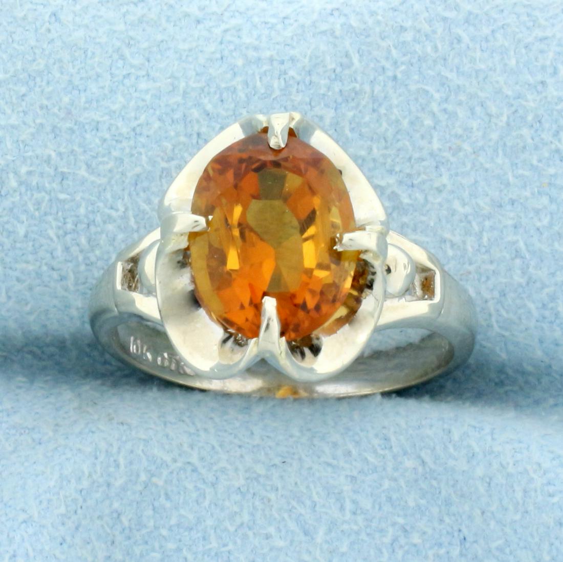 Unique 2.5ct Solitaire Citrine Ring in 10K White Gold: In 10K White Gold. Contains one high quality natural 9x7mm oval Citrine gemstone with intense orange yellow color and excellent clarity. Size 6 1/2. 3.8g