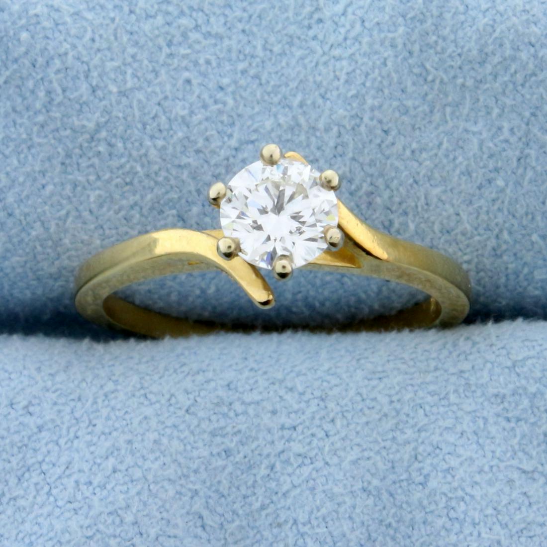 Over 1/2ct Diamond Solitaire Engagement Ring in 14k: In 18k yellow gold, .57ct round brilliant diamond with very high quality VS clarity/H color. Size 6 1/4. 2.5g.
