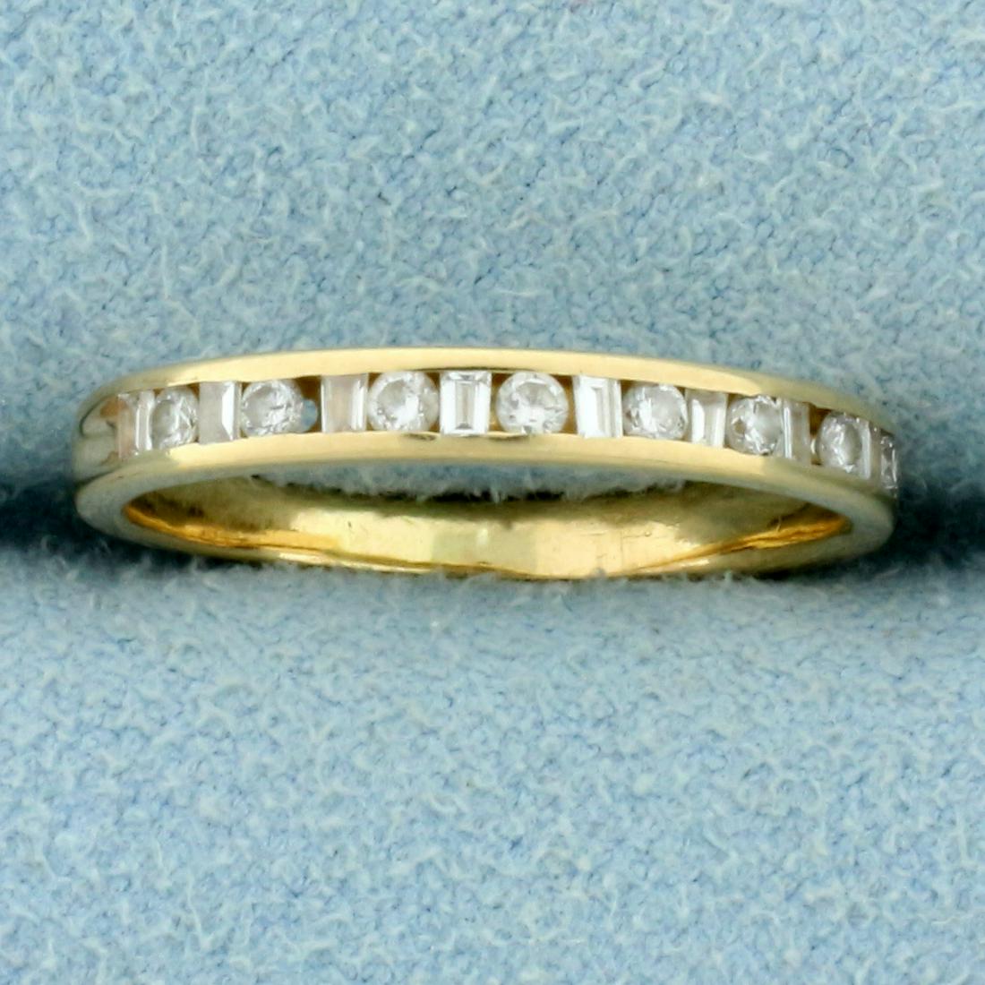 1/4ct TW Round and Baguette Diamond Wedding Band Ring: In 14k Yellow Gold. Contains nine .01ct baguette and eight .02ct round high quality Diamonds, SI clarity/H color. Size 5 1/2. 1.7g
