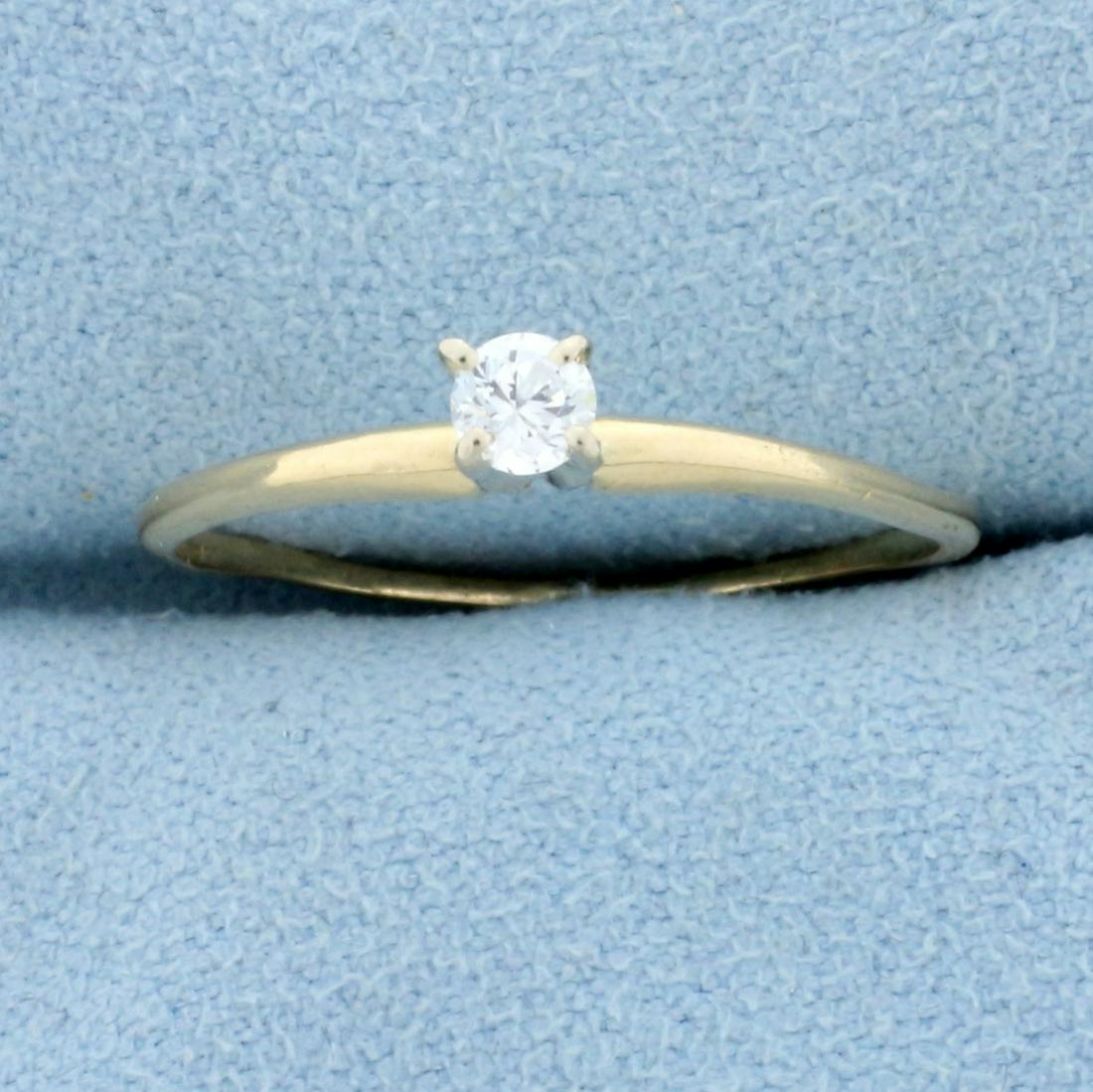 Diamond Solitaire Engagement Ring in 14K Yellow Gold: In 14K Yellow Gold. Contains one high quality 1/8ct Diamond, SI clarity/G color. Great cut for lots of sparkle. Thin band, great for stacking. Size 8 1/2. 1.1g.