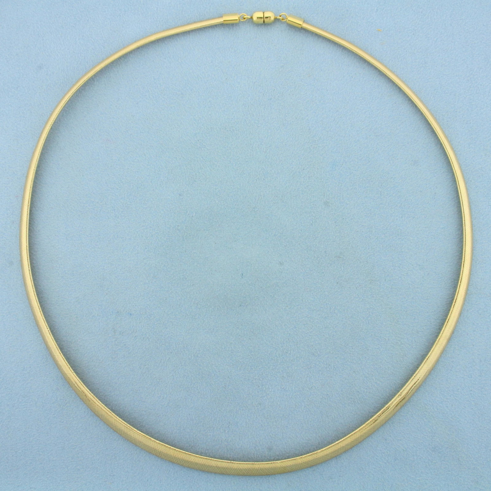 Unique Italian Made Mesh Design 20 Inch Italian Omega: In 14K Yellow Gold. 20 inches long. 7.2mm wide at center, 3.7mm wide at ends. Magnetic clasp for easy putting on and taking off. 9.5g