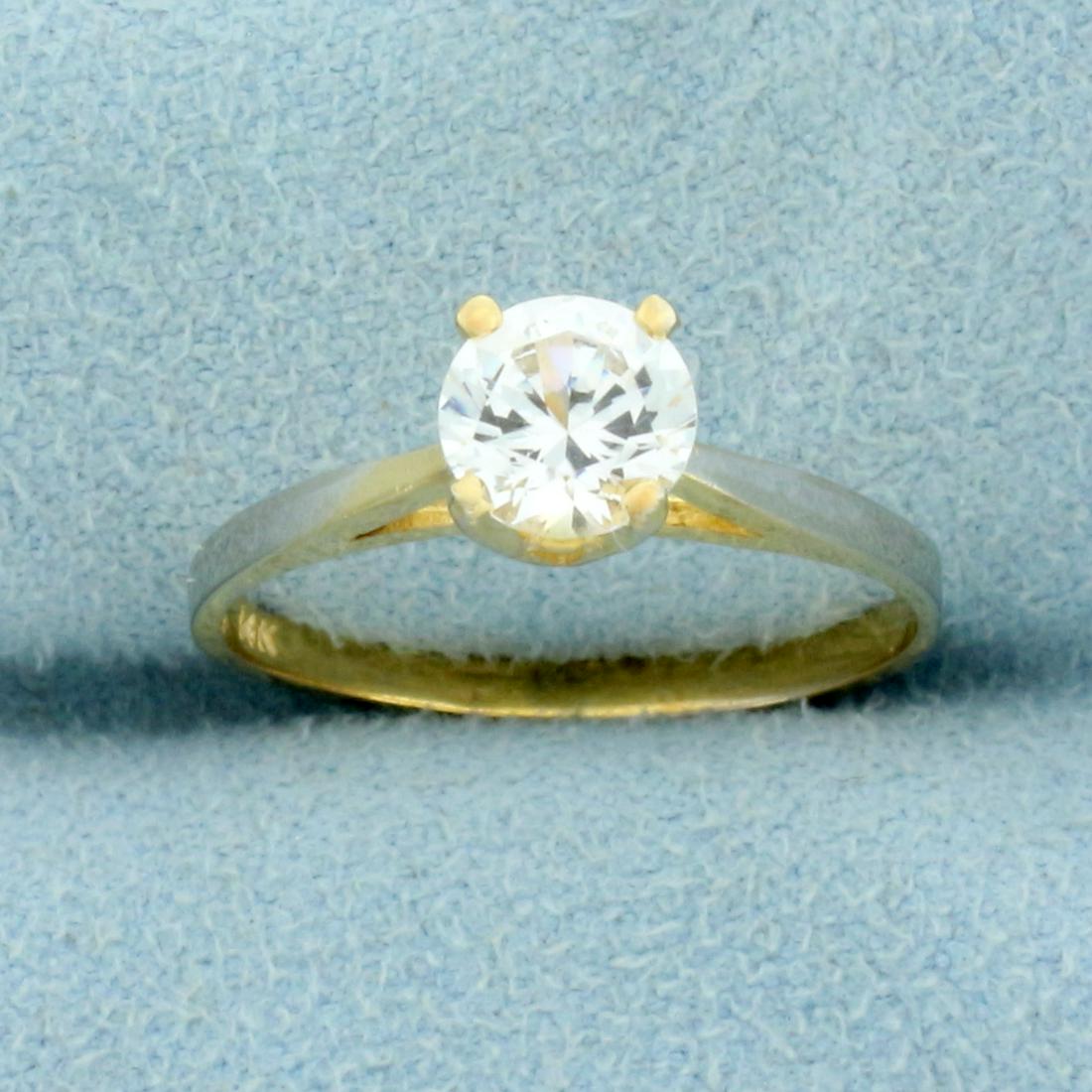 3/4CT White Sapphire Solitaire Engagement Ring in 14K: In 14K Yellow Gold. Contains one high quality natural 3/4ct White Sapphire Gemstone with excellent clarity and lots of sparkle. Size 6 1/2. 1.6g.