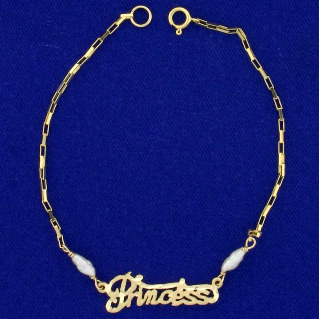 Pearl "Princess" Chain Link Bracelet in 14K Yellow Gold: In 14K Yellow Gold. Contains two high quality natural 7mm baroque Pearls with great color and luster. 7 1/4 inches long with spring clasp. 1.7g