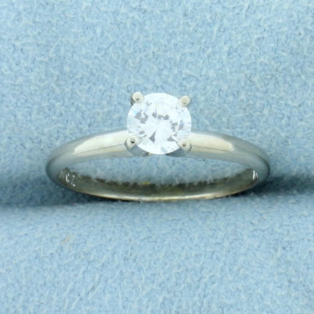 1/2ct CZ Solitaire Engagement Ring in 10K White Gold: In 10K White Gold. Contains one high quality 1/2ct Cubic Zirconia gemstone with bright white color, excellent clarity, and lots of sparkle. Size 5 3/4. 1.5g.