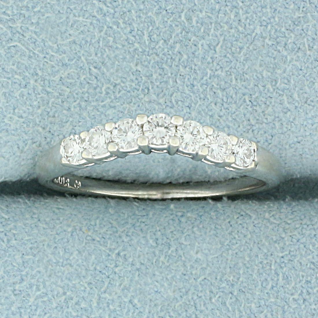 1/3ct TW Curved Diamond Wedding Band Ring in 14K White: In 14K White Gold. Contains seven high quality diamonds, 1/3ct TW, SI clarity/G color. Band is curved so it can sit flush against an Engagement Ring. Size 6. 2.0g.