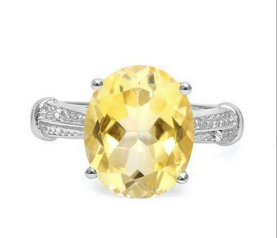Huge 4.3CT Citrine & Diamond Statement Ring in Sterling: Oval cut 4.31ct citrine gemstone ring with lemon color, accented with .01ctw genuine diamonds. Size 7. Set in platinum over sterling silver, 3.2g.