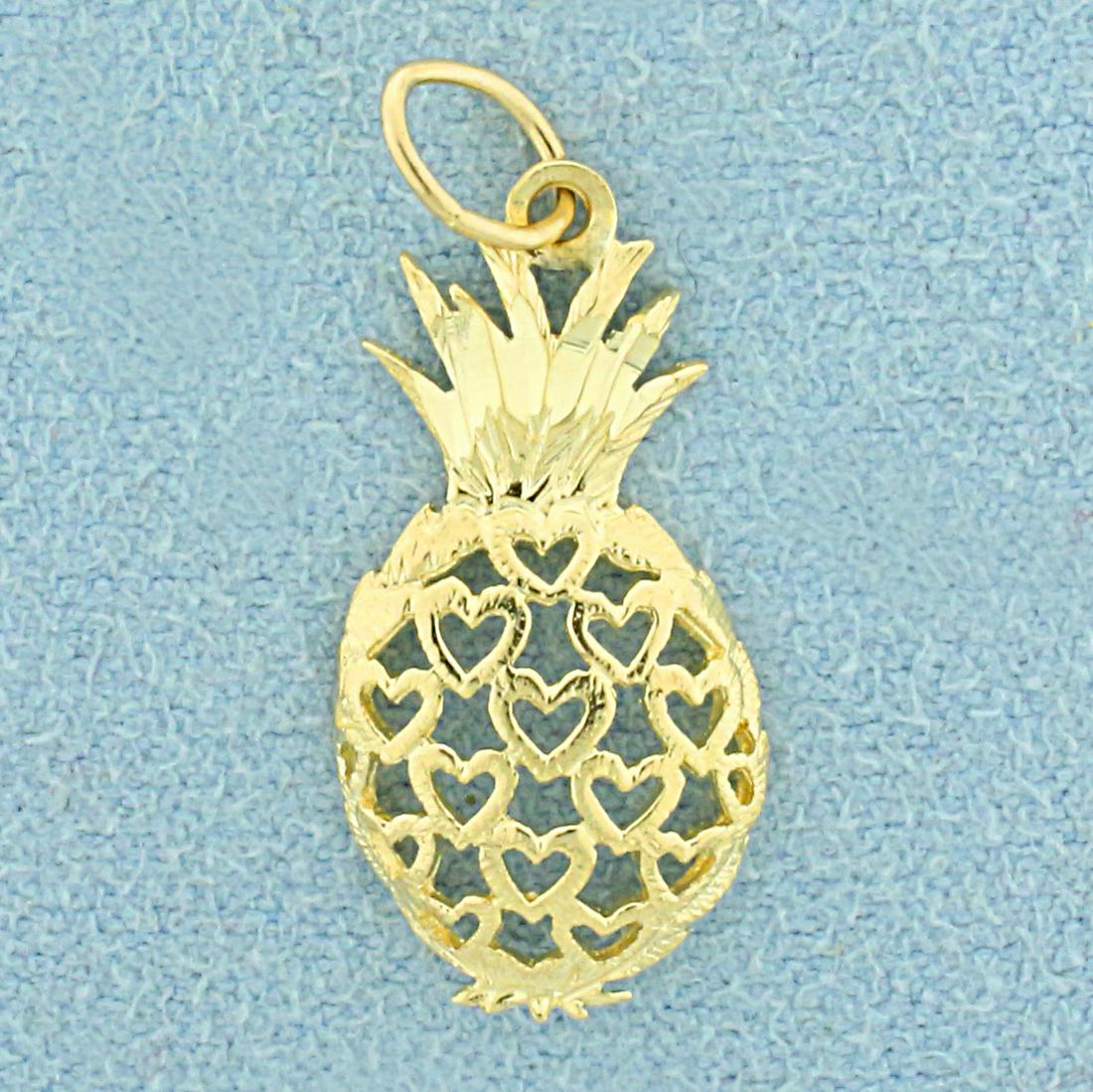 Pineapple Heart Pendant in 14K Yellow Gold: In 14K Yellow Gold. 1 inch long including bale. 10.2mm wide. 0.8g