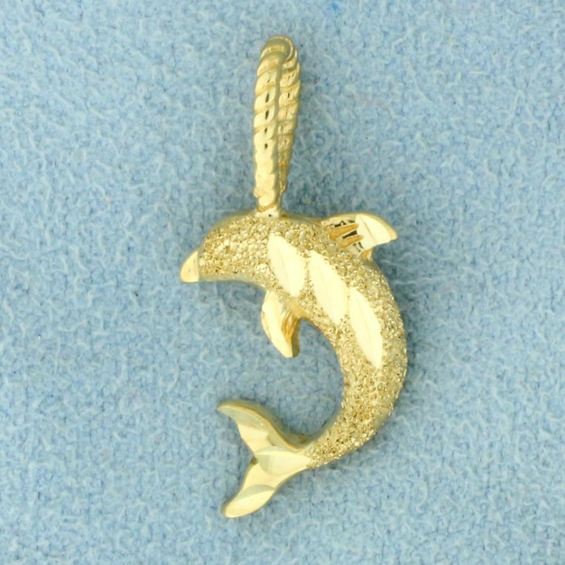 Diamond Cut Dolphin Pendant in 14K Yellow Gold: In 14K Yellow Gold. 1 inch long including bale. 1.4g.