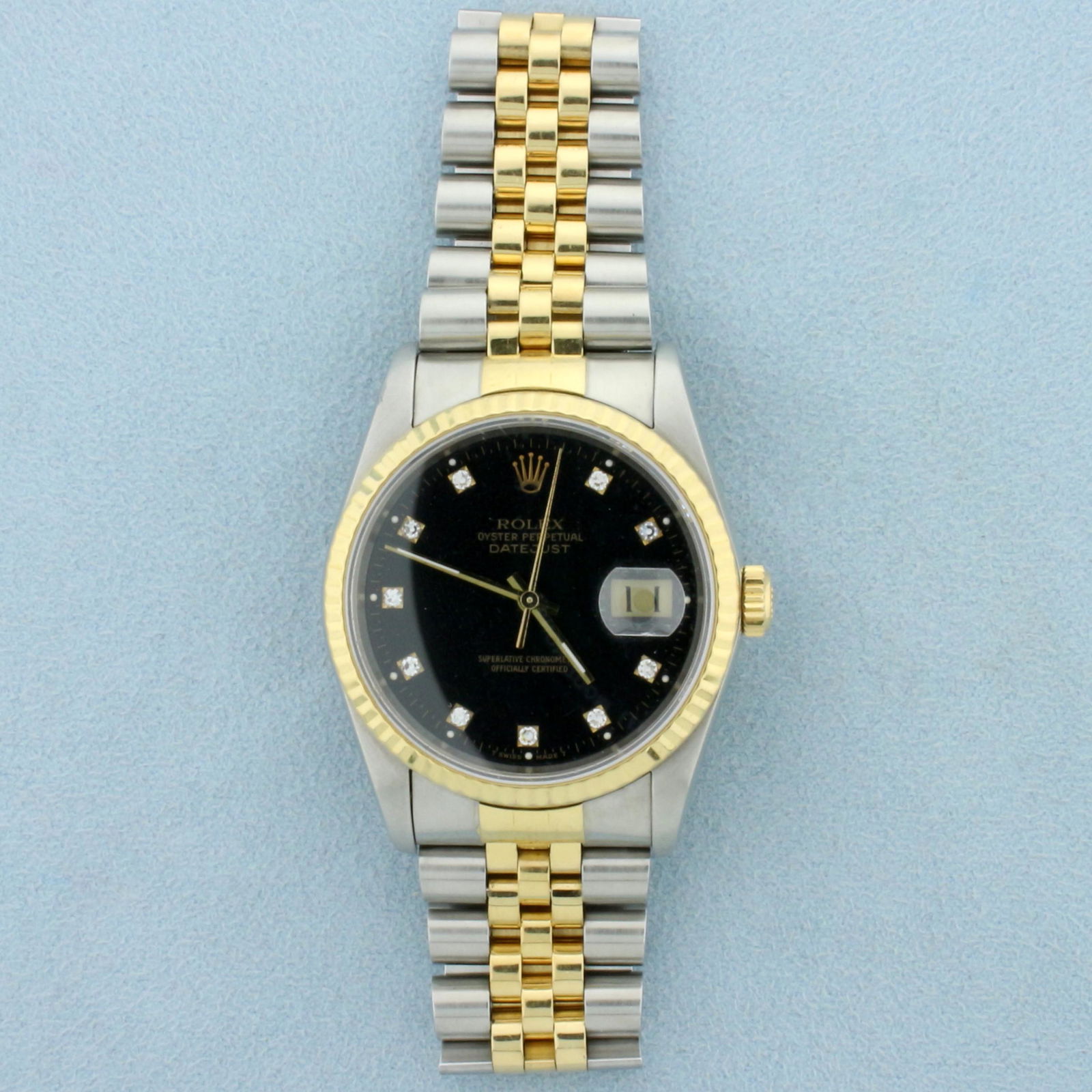 Men's Rolex DateJust 36mm Watch With Black Diamond Dial: In Stainless Steel and 18k Yellow Gold. Watch comes with original box and papers, guaranteed authentic. Originally purchased in 1989. Movement just serviced, runs great. Great overall condition, no sc