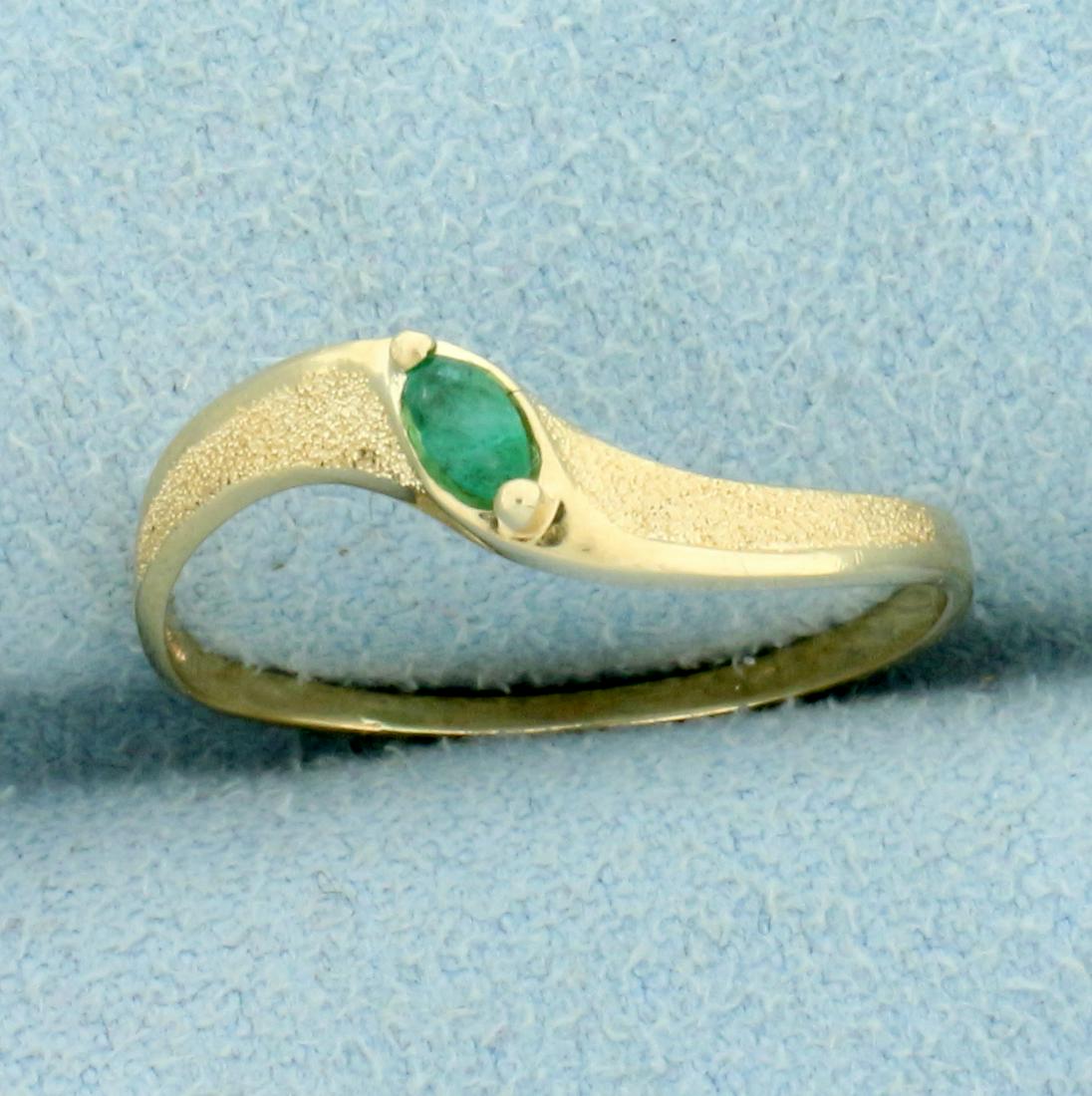 Natural Emerald Solitaire Ring in 10K Yellow Gold: In 10K Yellow Gold. Contains a high quality natural 4x2mm marquise cut Emerald gemstone with bright green color. Size 7 1/4. 1.0g
