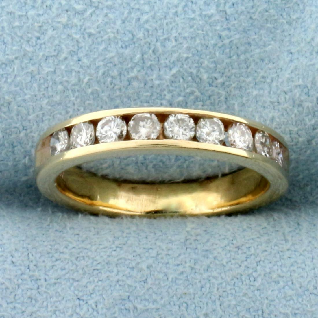 1/2ct TW Diamond Wedding or Anniversary Band Ring in: In 14K Yellow Gold. Contains nine high quality Diamonds, 1/2ct TW, SI clarity/H color. Size 5 1/4. 3.1g.