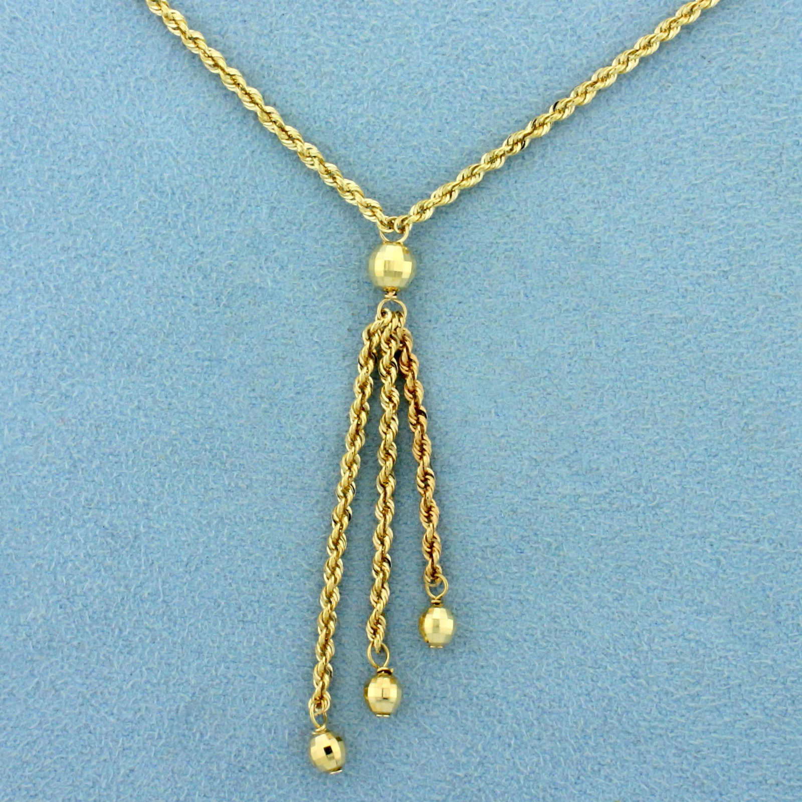 Rope Link Tassel Chain Necklace in 14K Yellow Gold: In 14K Yellow Gold. Rope Link Chain is 19 inches long, 1.8mm wide, with lobster clasp. 2.5g.