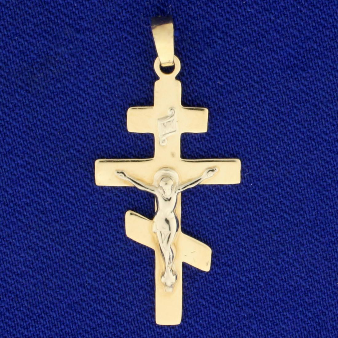 Byzantine Orthodox Crucifix Pendant in 14K Yellow Gold: In 14K Yellow Gold. 1 1/4 inch long including bale. 3/8 inch wide. 1.2g