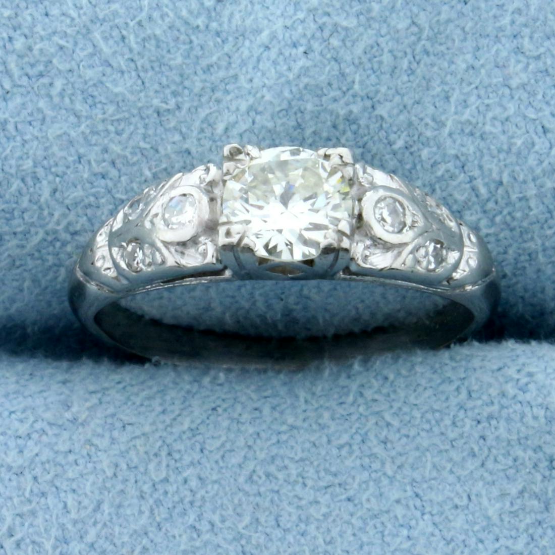 Vintage Art Deco Diamond Ring in Platinum: In Platinum. Contains one high quality .5ct round cut Diamond, VS clarity/ J color. Also contains two high quality .02ct Diamonds and four 1/2pt Diamonds, all with similar high quality. Size 2 1/4. 3.