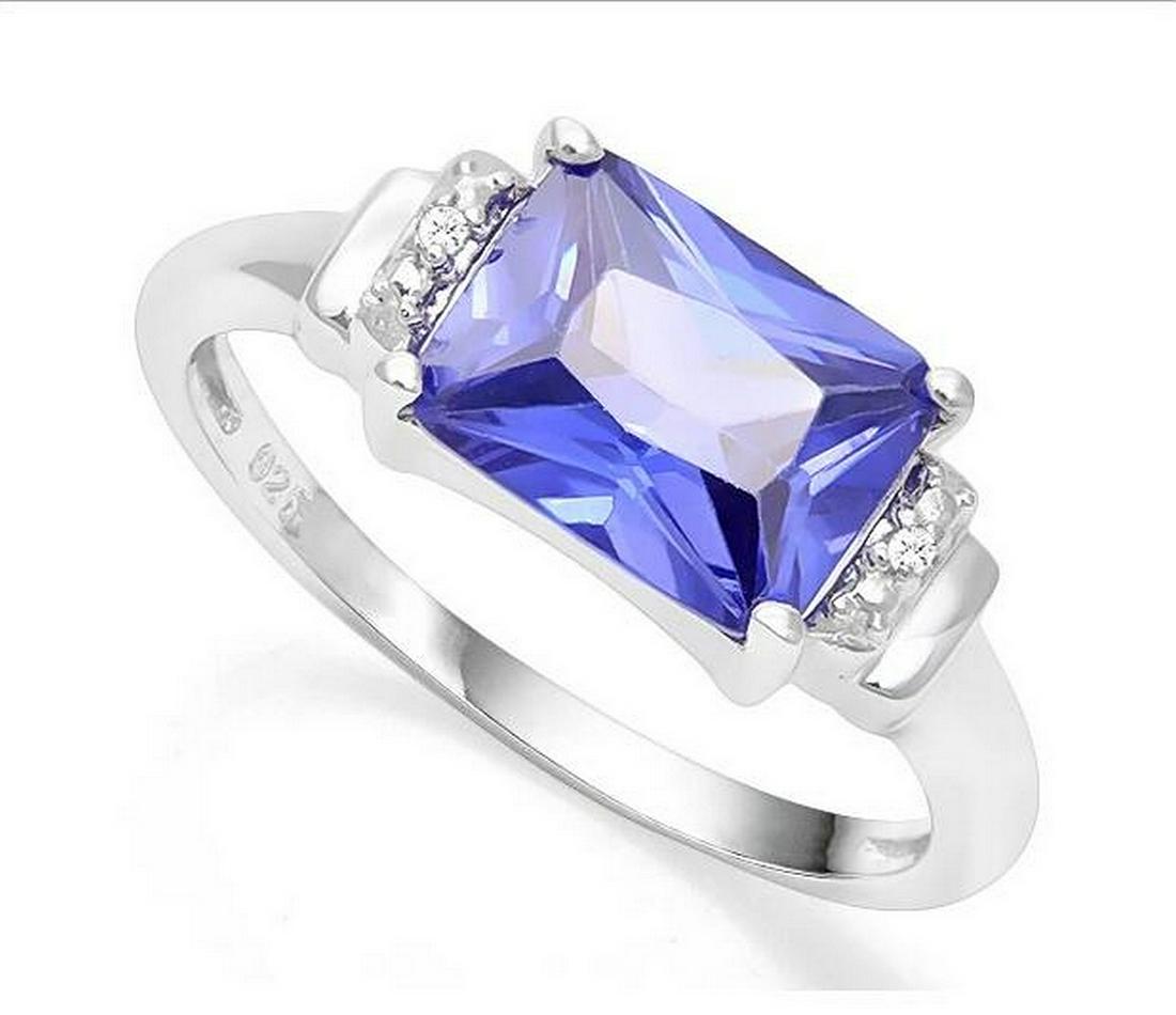 3.6CT Tanzanite & Diamond Ring in Sterling Silver: Fancy radiant cut 3.62ct lab created genuine Tanzanite gemstone ring with excellent color and clarity, accented with .01ctw genuine diamonds. Size 7. Set in platinum over sterling silver, 3.1g.