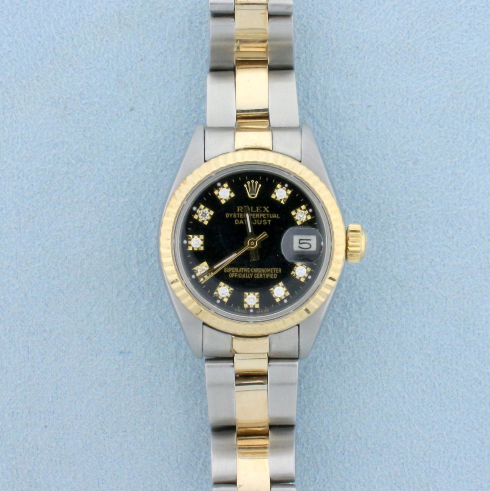 Womens Rolex Datejust Watch With Diamond Dial and: In Stainless Steel and 18k Yellow Gold. Recently serviced and cleaned, runs great. 26mm case. No scratching on crystal, very little stretch on band. Black face with diamond dial. Comes with inner and