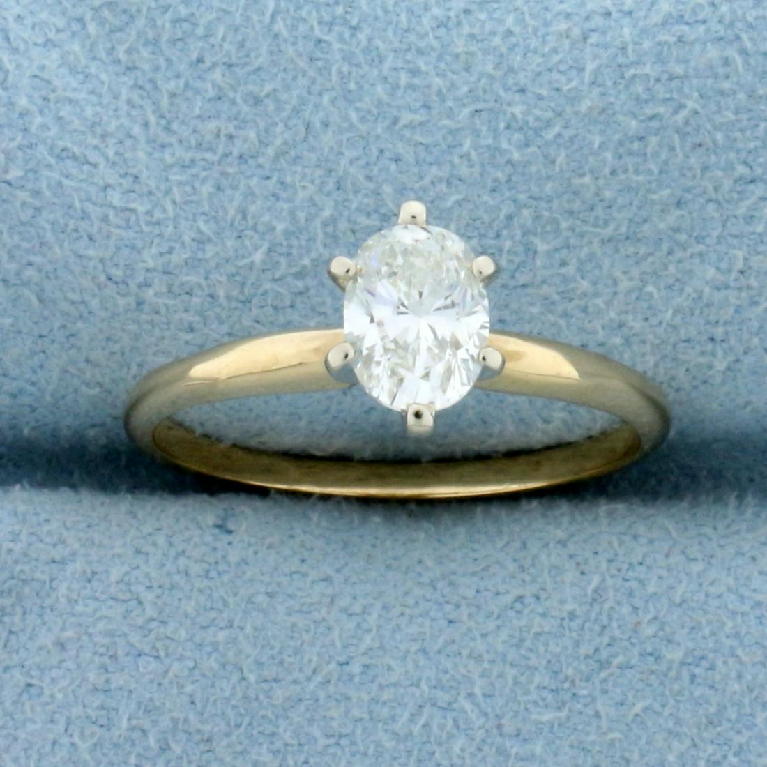 3/4ct Oval Diamond Solitaire Engagement Ring in 14K: In 14K Yellow Gold. Contains one high quality3/4ct oval cut Diamond, VS clarity/J color, great cut for lots of sparkle.. Size 6 1/2. 1.9g.