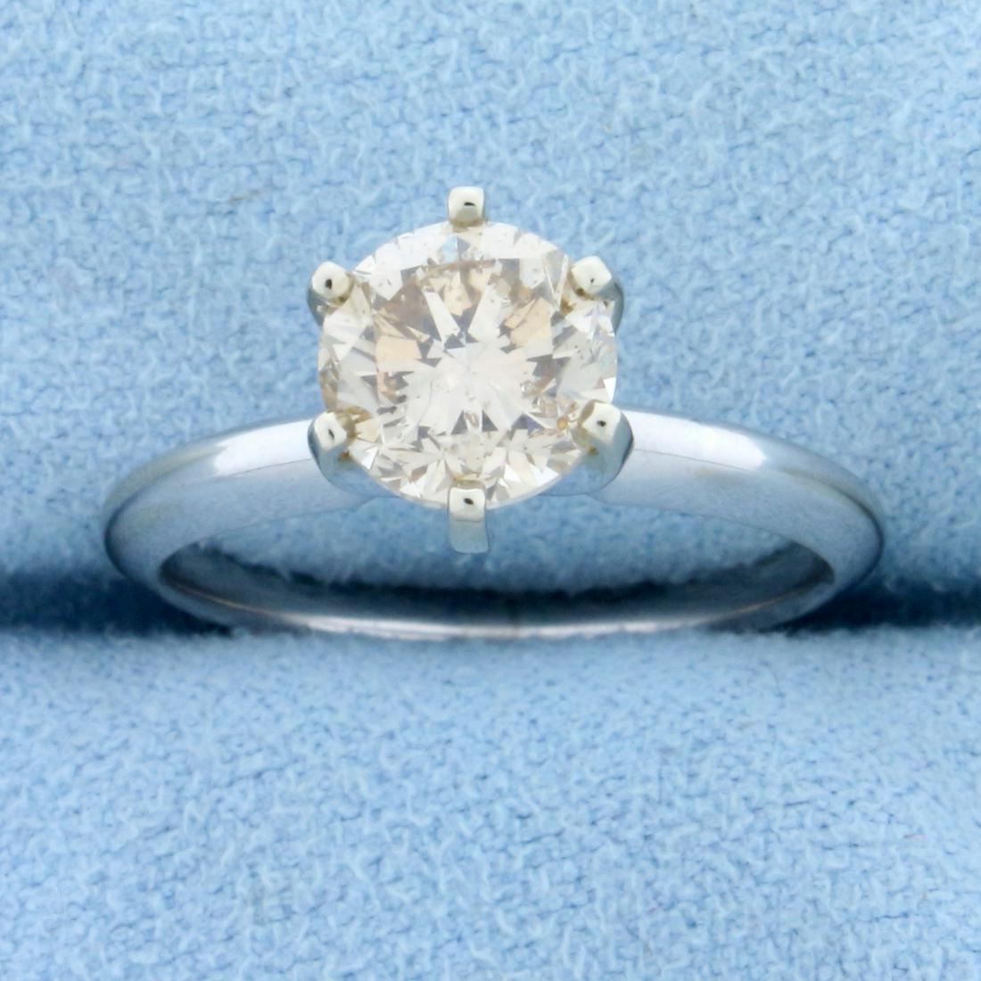 1.25ct Champagne Diamond Solitaire Engagement Ring in: In 14K White Gold. Contains 1 1/4ct round brilliant champagne diamond with warm champagne color and excellent cut for lots of sparkle. Size 6. 3.3g