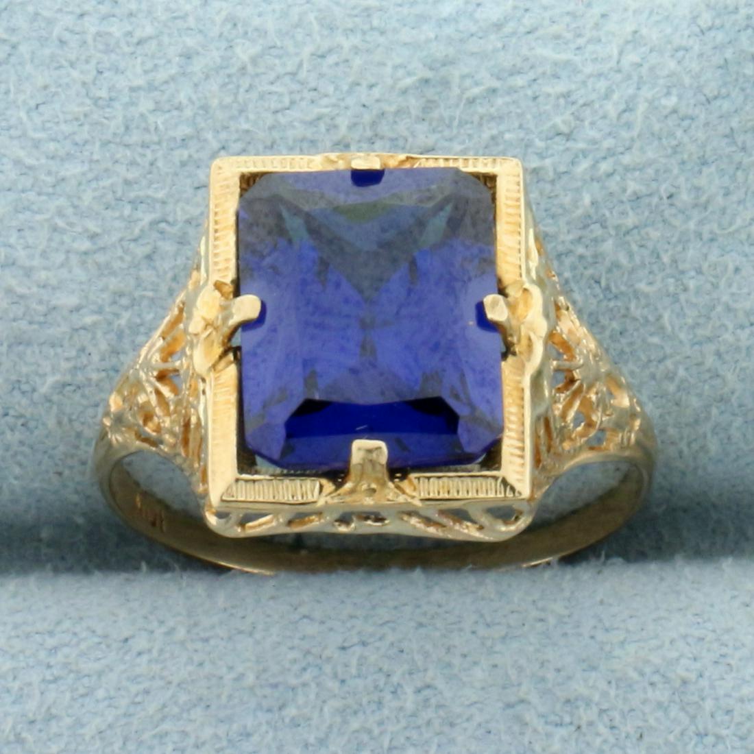 Vintage 4ct Lab Sapphire Solitaire Filigree Ring in 10K: In 10K Yellow Gold. Contains one high quality natural 10x8mm Lab Sapphire gemstone with perfect velvet blue color and excellent clarity. Size 6. 1.9g