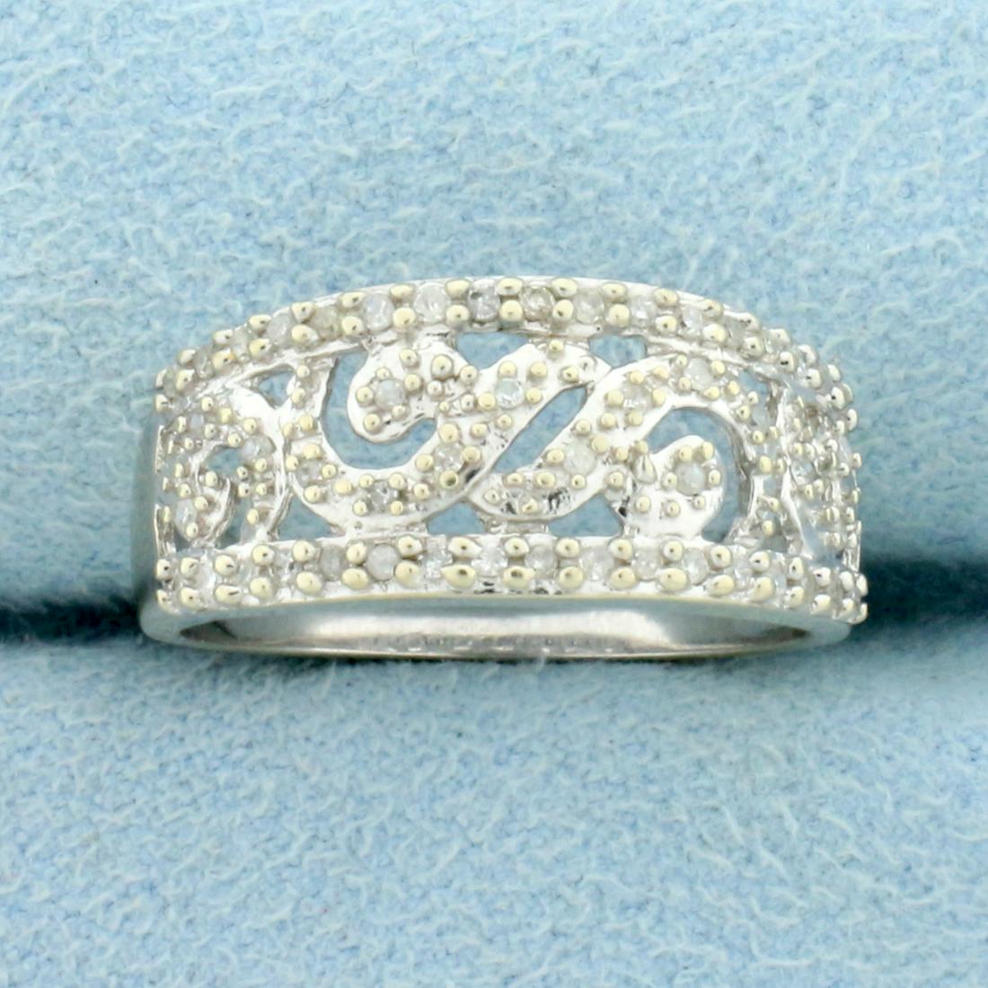 Diamond Wave Ring in 10K White Gold: In 10K White Gold. Contains fifty high quality 1/2pt round cut Diamonds. Size 7 1/4. 3.0g.