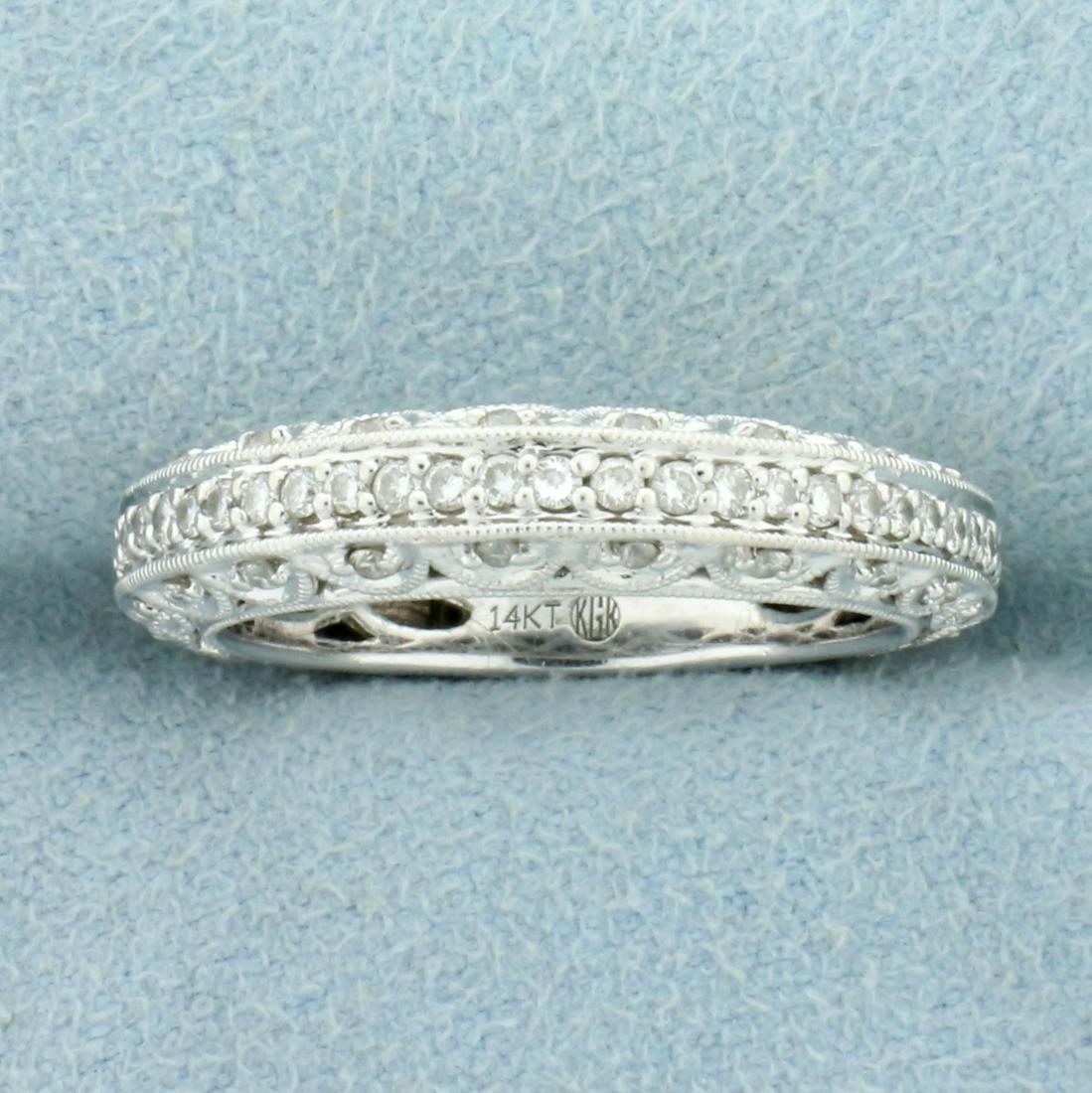 Unique Diamond Wedding Band Ring in 14K White Gold: In 14K White Gold. Contains fifty-one high quality 1/2 pt Diamonds. Size 7 1/4. 4.9g
