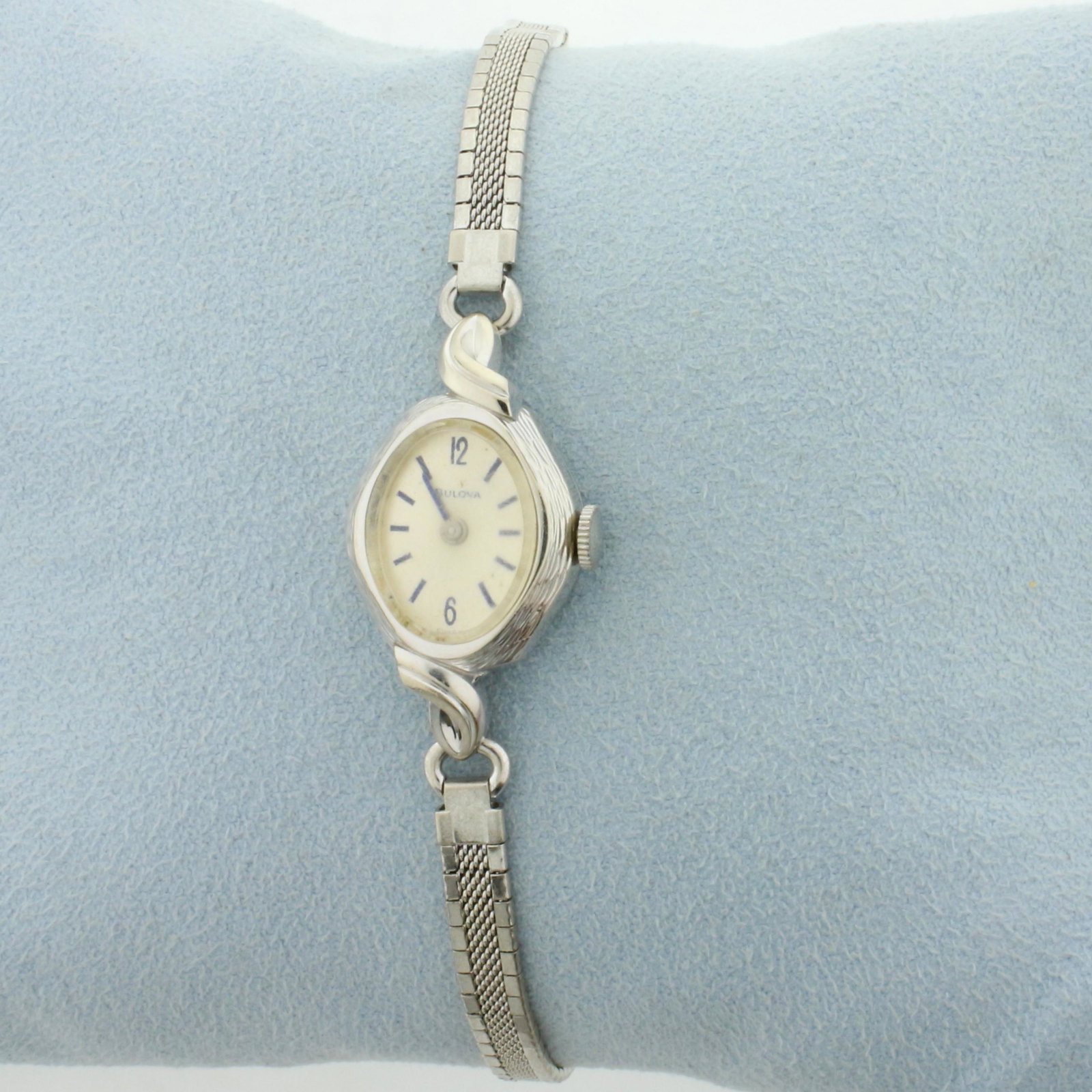 Antique Womens Bulova Wrist Watch in 10K White Gold: In 10K White Gold Filled. Windup movement runs great, great overall condition with minimal scratching on case, some scratching on crystal. Case is 19x16mm. Safety chain. 6 1/2 inches long. 10.8g