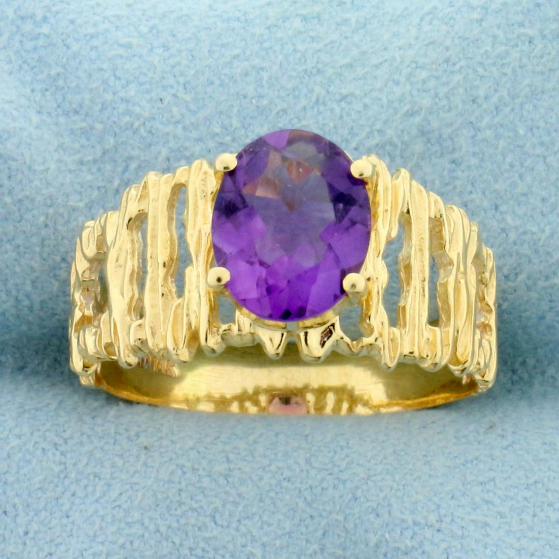 Unique Amethyst Solitaire Ring in 14K Yellow Gold: In 14K Yellow Gold. Contains one high quality natural 2ct oval cut Amethyst gemstone with intense purple color and excellent clarity. Size 9 1/2. 4.2g.