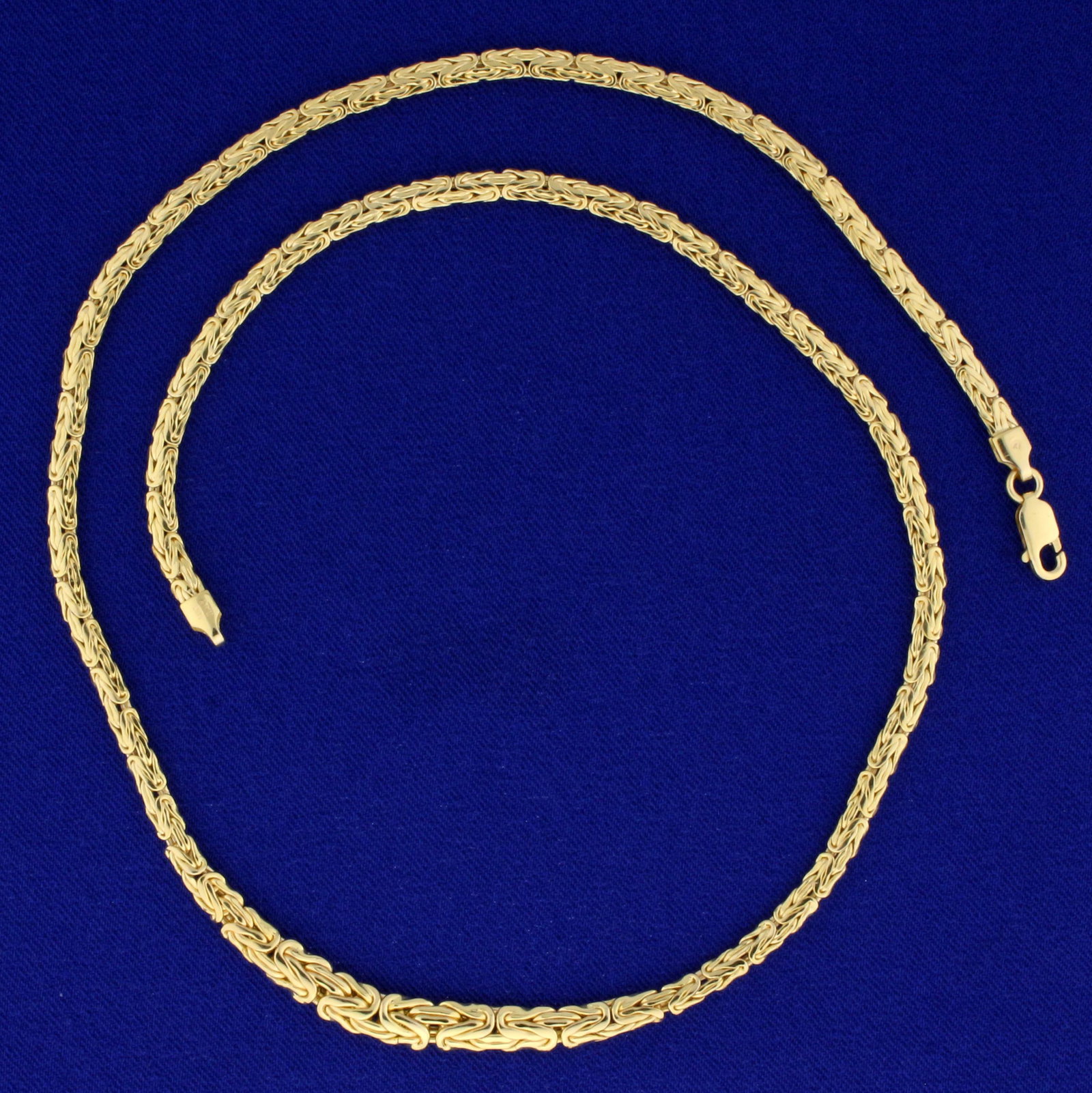 18 Inch Graduated Byzantine Chain Necklace in 14K: In 14K Yellow Gold. 18 inches long. 3.3mm wide(at ends), 4.9mm wide(at center). Lobster clasp. 9.4g