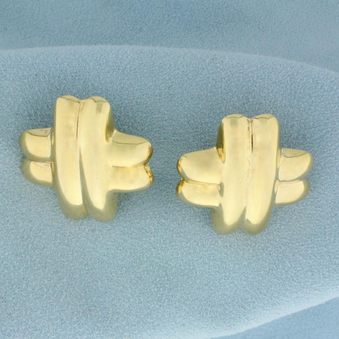 X Design Earrings in 14K Yellow Gold: In 14K Yellow Gold. 1 1/8 Inch long. French Omega backs for pierced ears. 7.7g