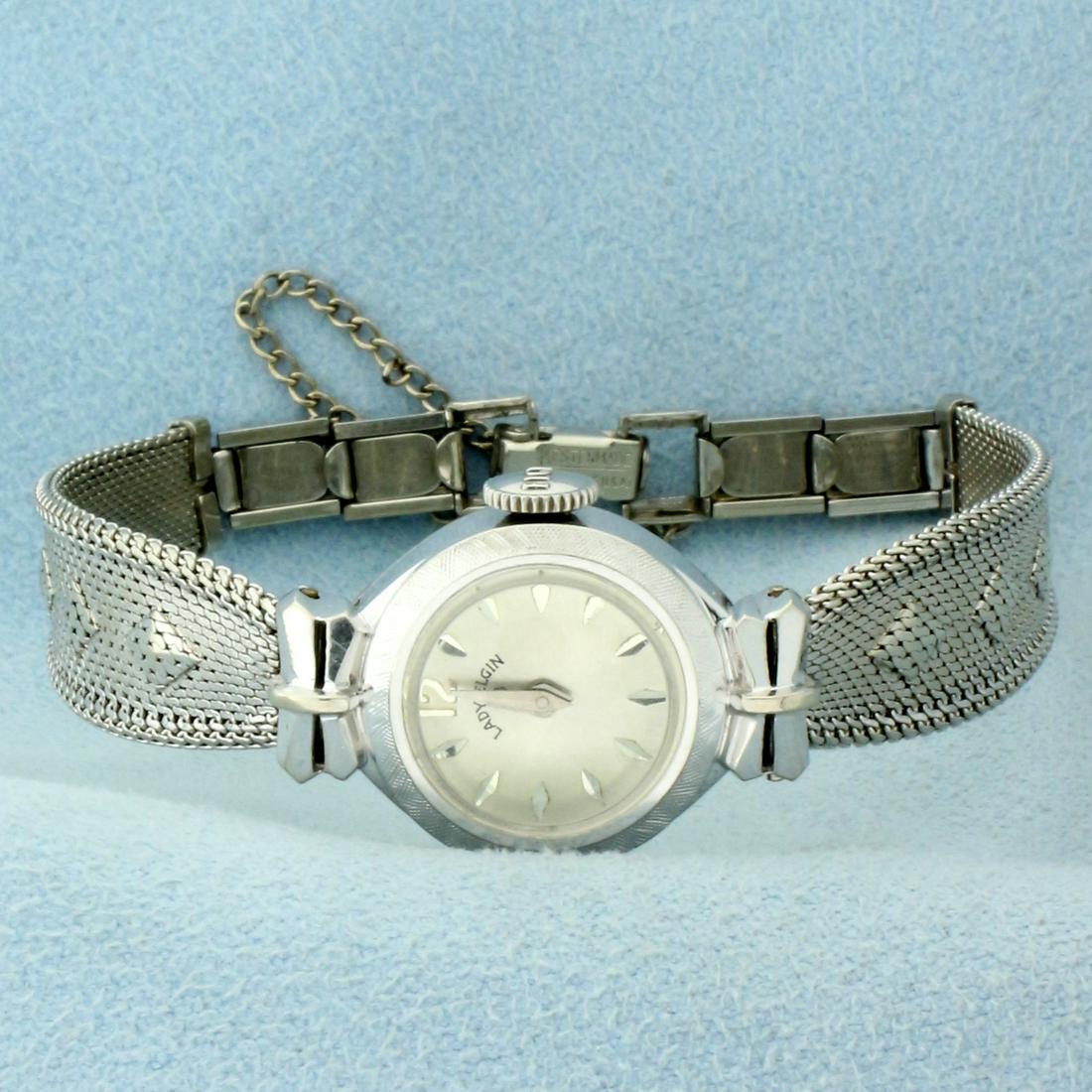 Antique Lady Elgin Wrist Watch in 10k White Gold Filled: In 10K White Gold Filled. Windup movement runs great, great overall condition with minimal scratching on crystal or case. Case is 16mm diameter. Safety chain. 6 1/2 inches long. 13.1g
