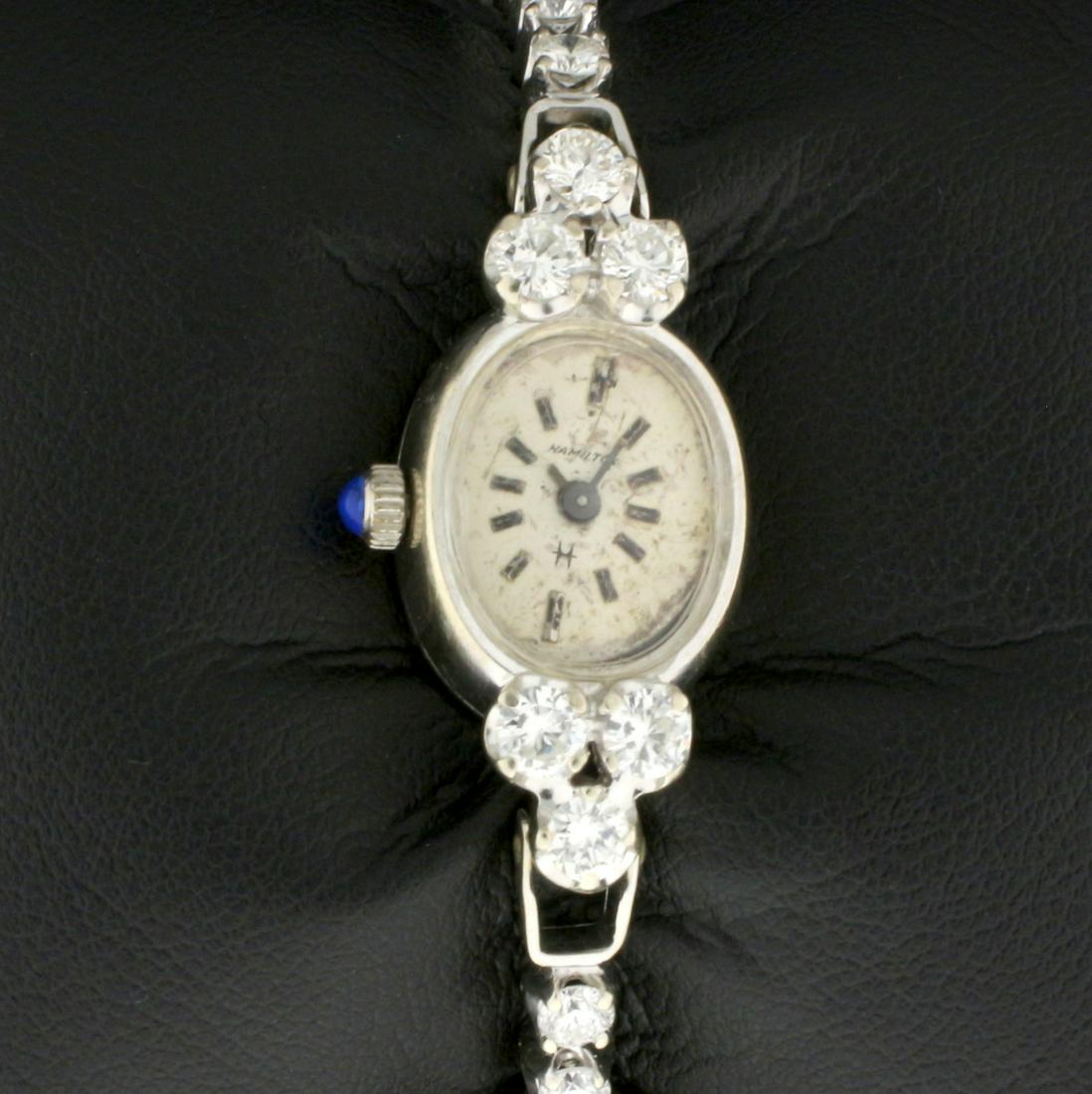 Vintage 2ct TW Diamond 14k Solid Gold Hamilton womens: Case and Band In solid 14K White Gold. Quartz movement runs great, keeps time. Watch in good condition for age, some scratching on crystal and case as well as some discoloration on dial but expected g